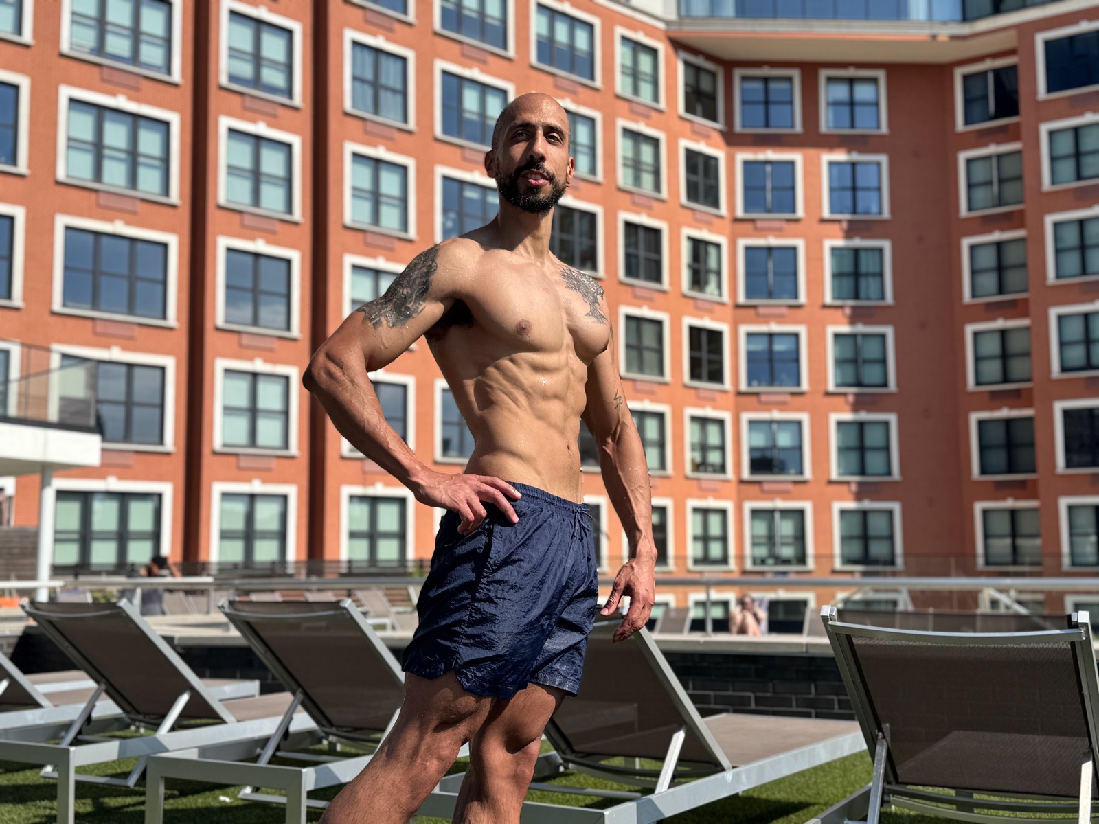 Vinnie Rodriguez, natural vegan bodybuilder, poolside physique