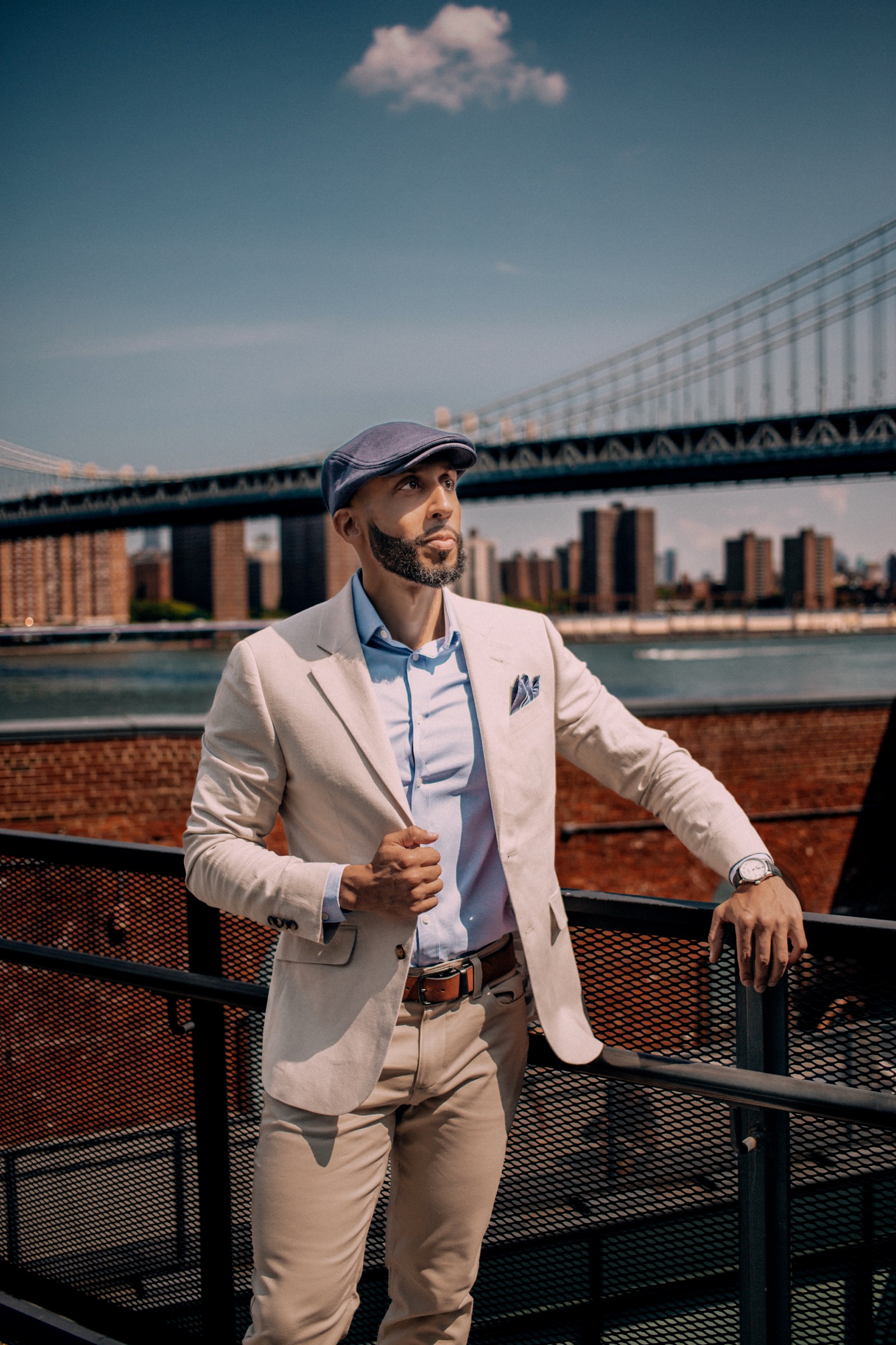 Vinnie Rodriguez in DUMBO, Brooklyn with the Manhattan Bridge behind him